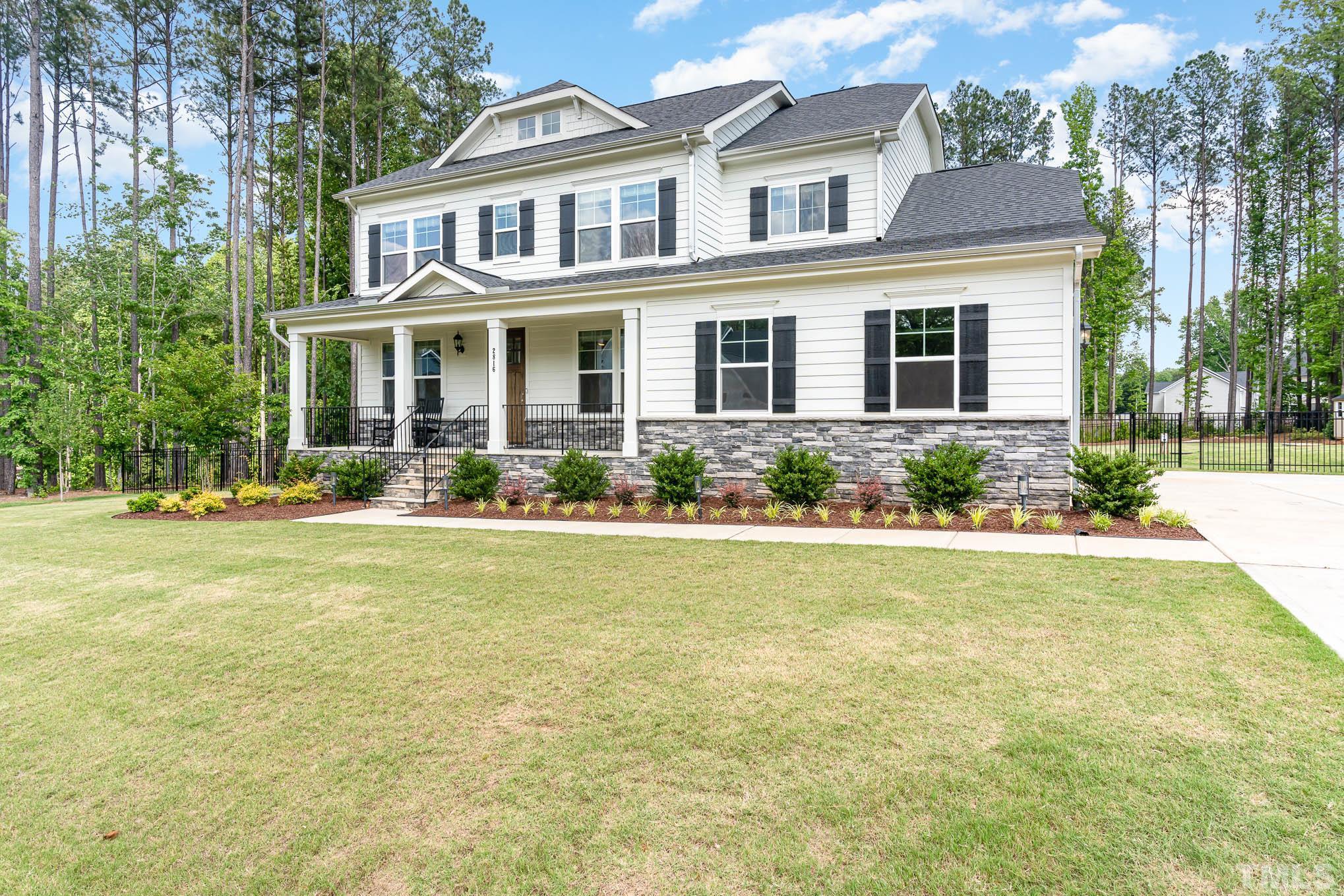 2816 Flume Gate Drive Raleigh, NC 27603 - Photo 2 of 45 a front view of a house with swimming pool