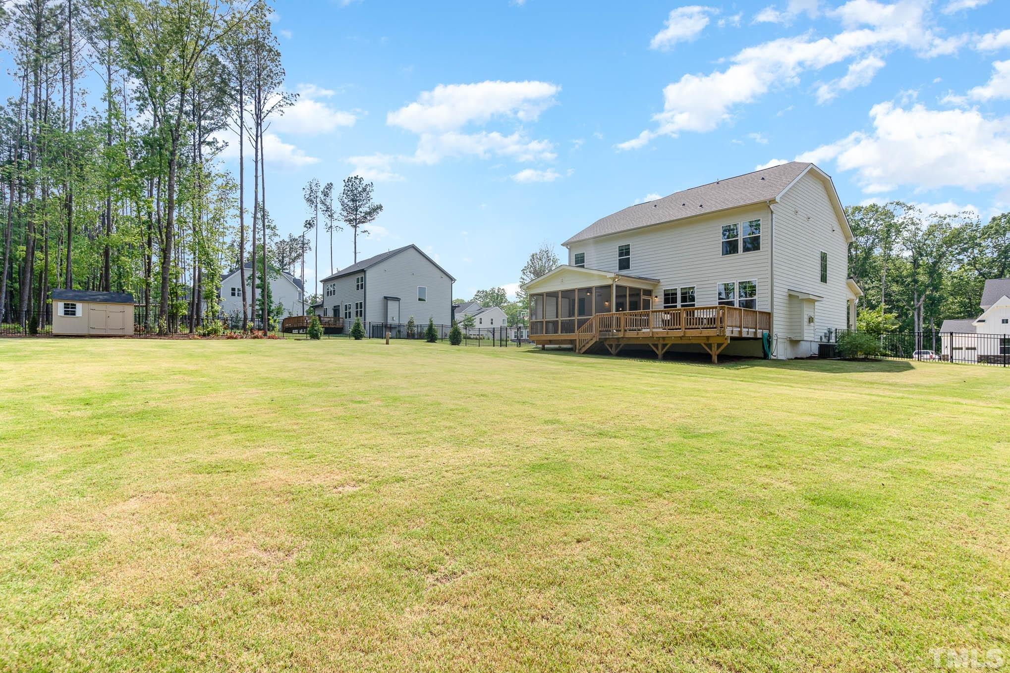 2816 Flume Gate Drive Raleigh, NC 27603 - Photo 36 of 45 a view of a house with a yard