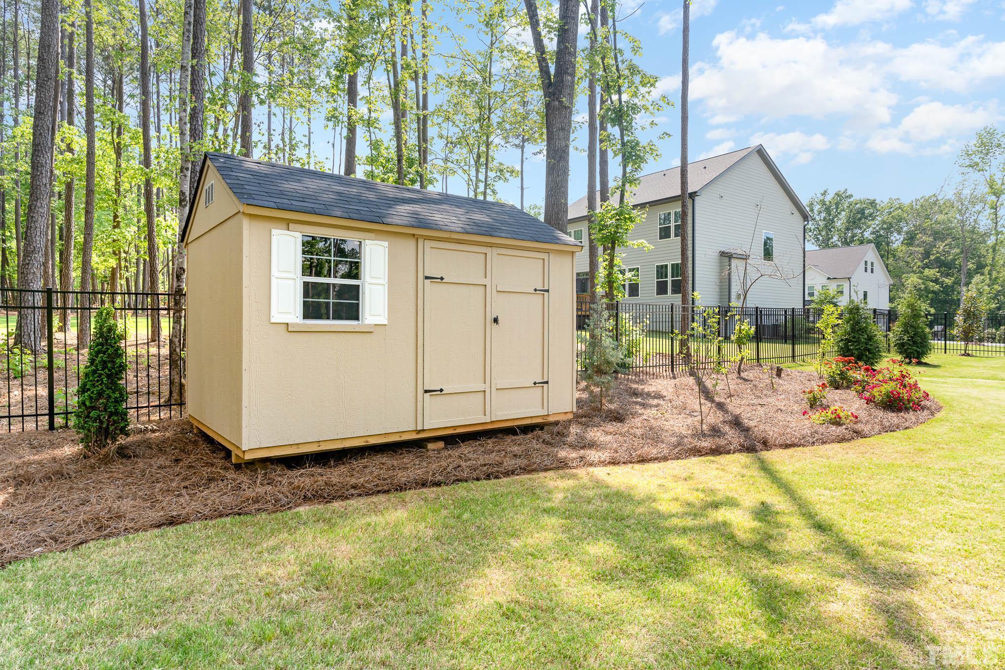 2816 Flume Gate Drive Raleigh, NC 27603 - Photo 38 of 45 a view of a house with backyard and sitting area