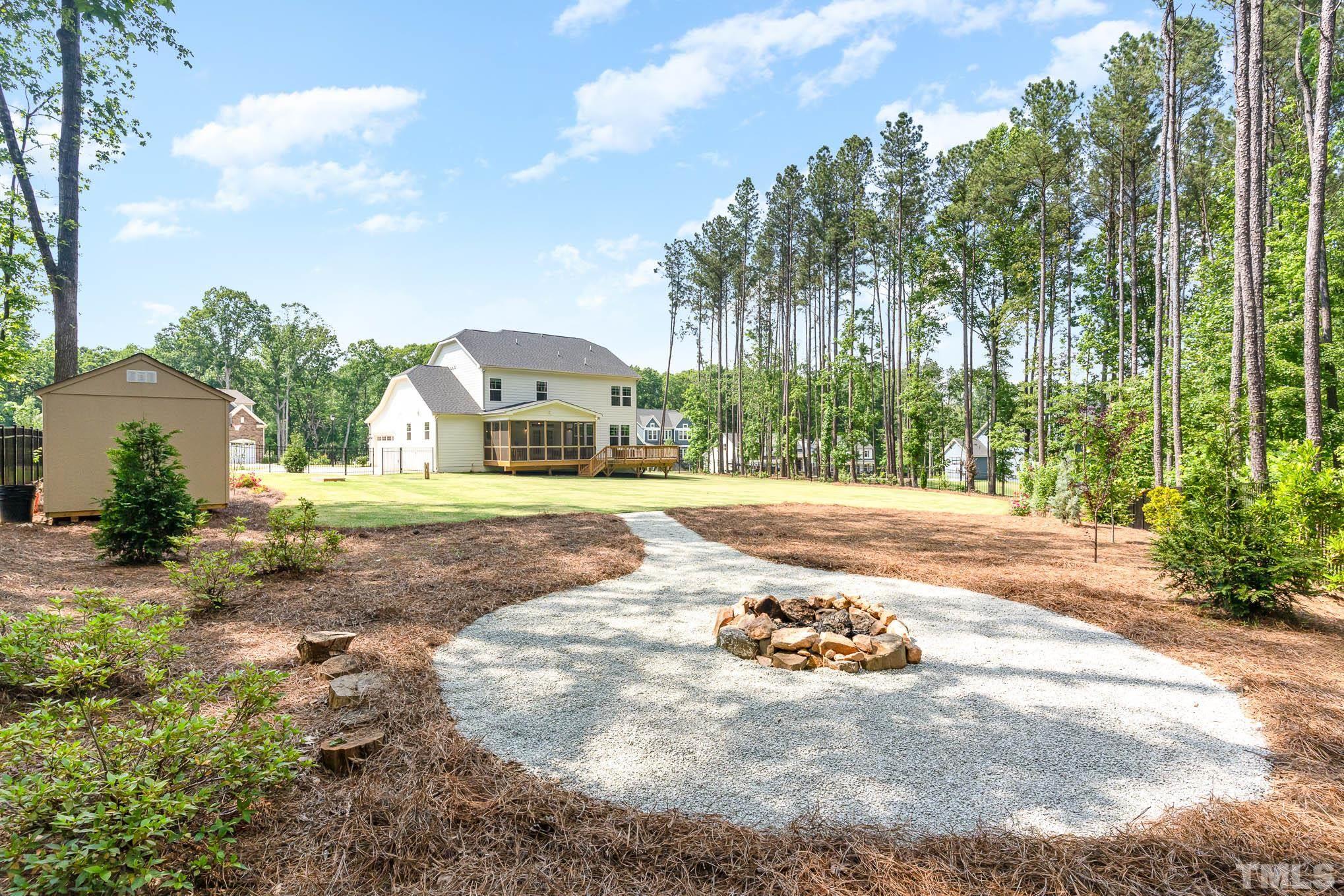 2816 Flume Gate Drive Raleigh, NC 27603 - Photo 39 of 45 a view of a house with a yard and sitting area
