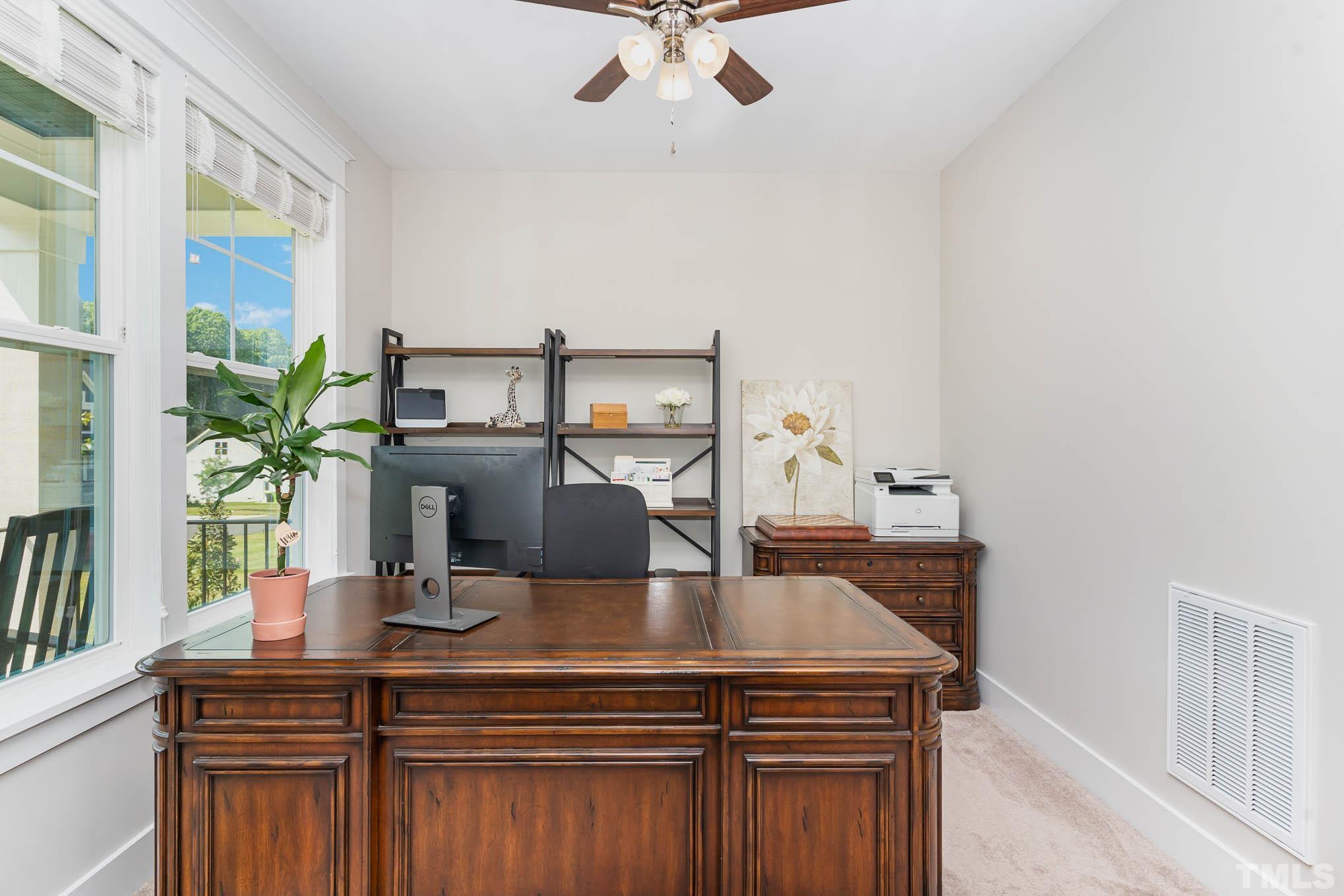 2816 Flume Gate Drive Raleigh, NC 27603 - Photo 7 of 45 a view of a dining room with furniture and a potted plant