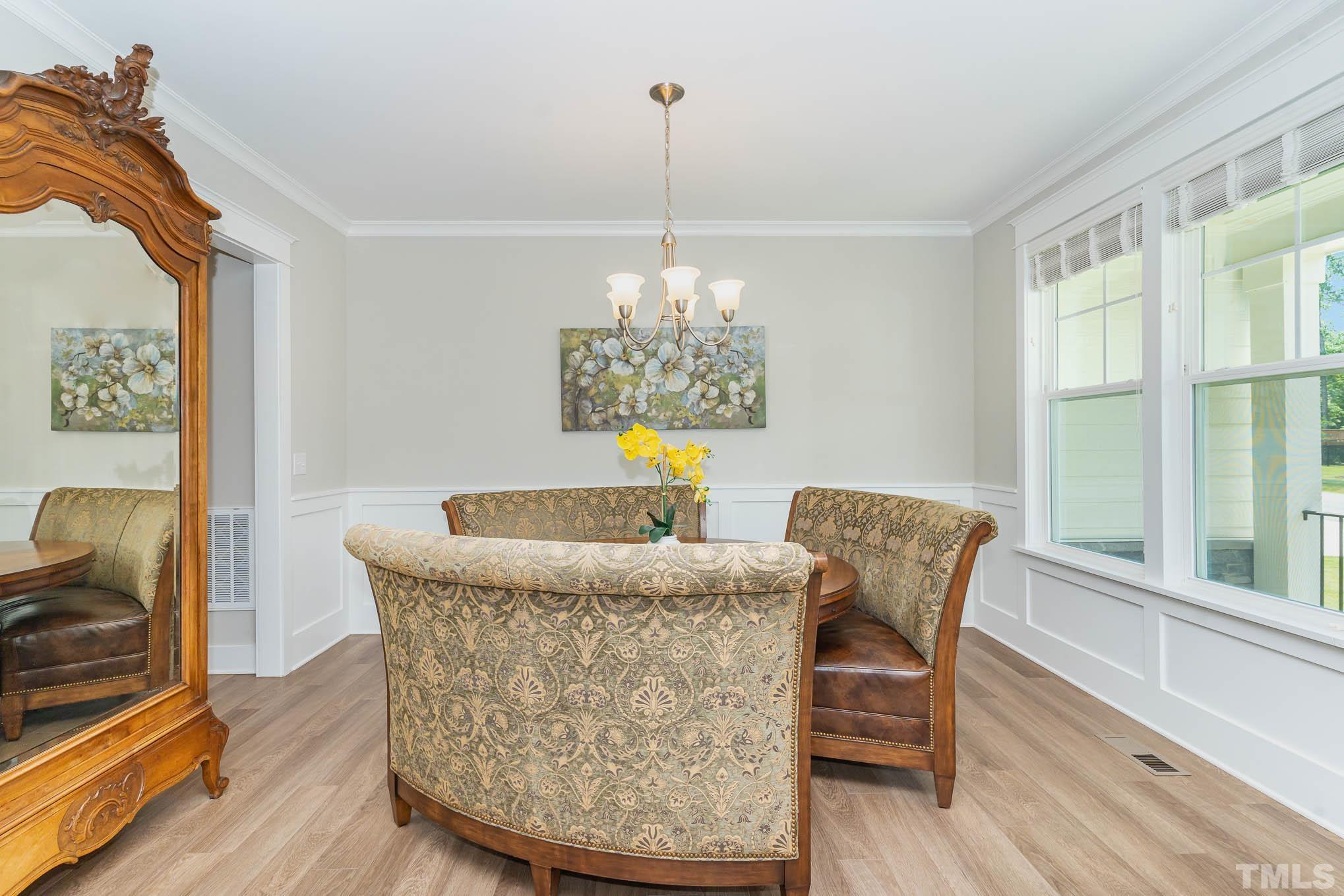 2816 Flume Gate Drive Raleigh, NC 27603 - Photo 8 of 45 a dining room with furniture and window