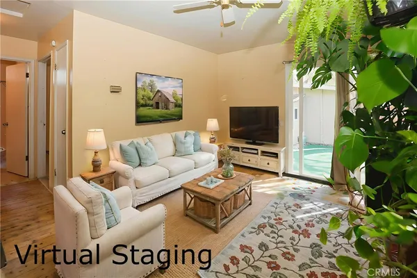 a living room with furniture and a flat screen tv