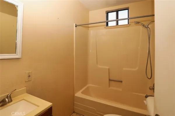 a bathroom with a sink and a shower
