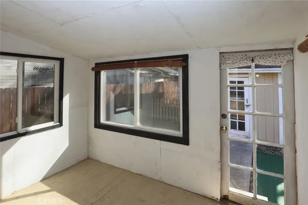 a view of an empty room with a window