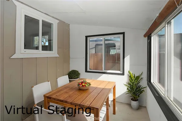 a dining room with furniture and window