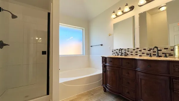 a bathroom with a bathtub and a sink