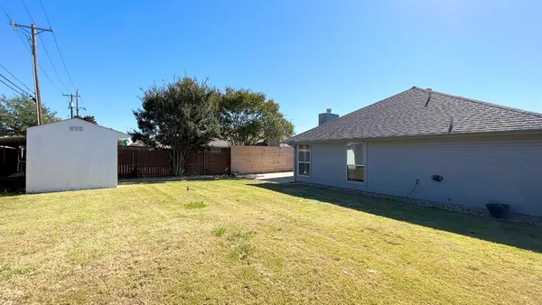 a house view with a backyard space