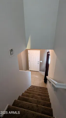 an aerial view of multiple houses with yard