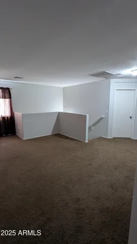 an aerial view of a house with a ocean view