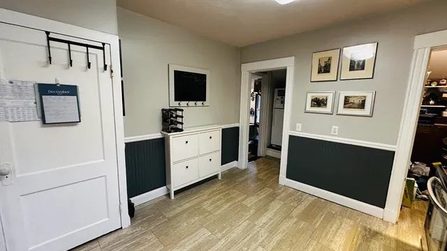a view of a kitchen with a sink and a refrigerator