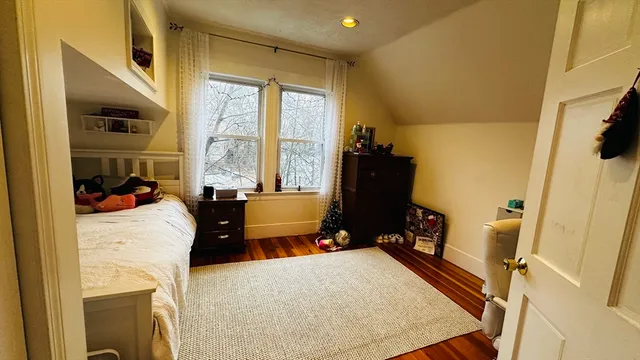 a bed room with furniture and a large window