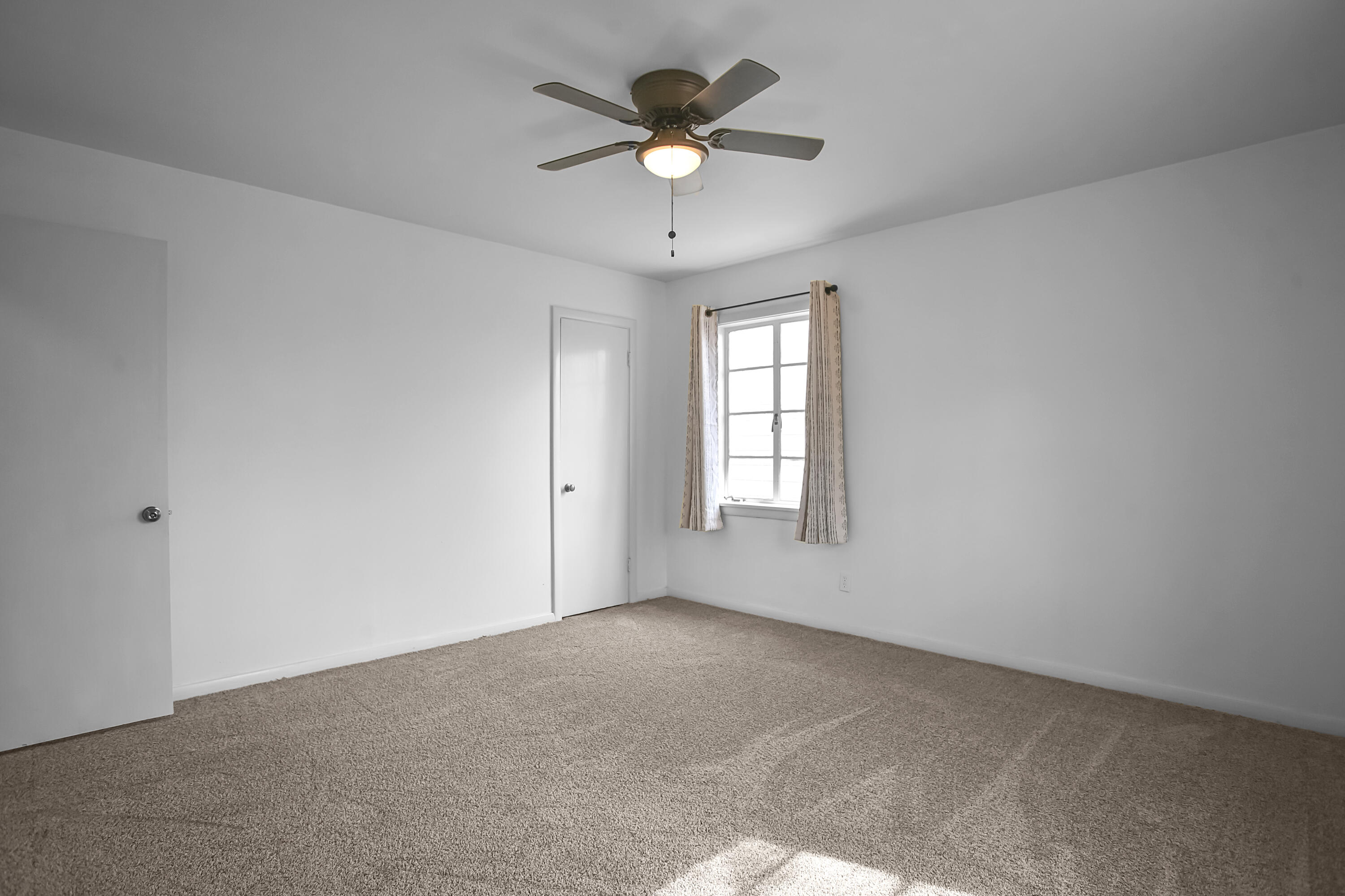 4309 31st Street Lubbock, TX 79410 - Photo 12 of 30 a view of an empty room with a window