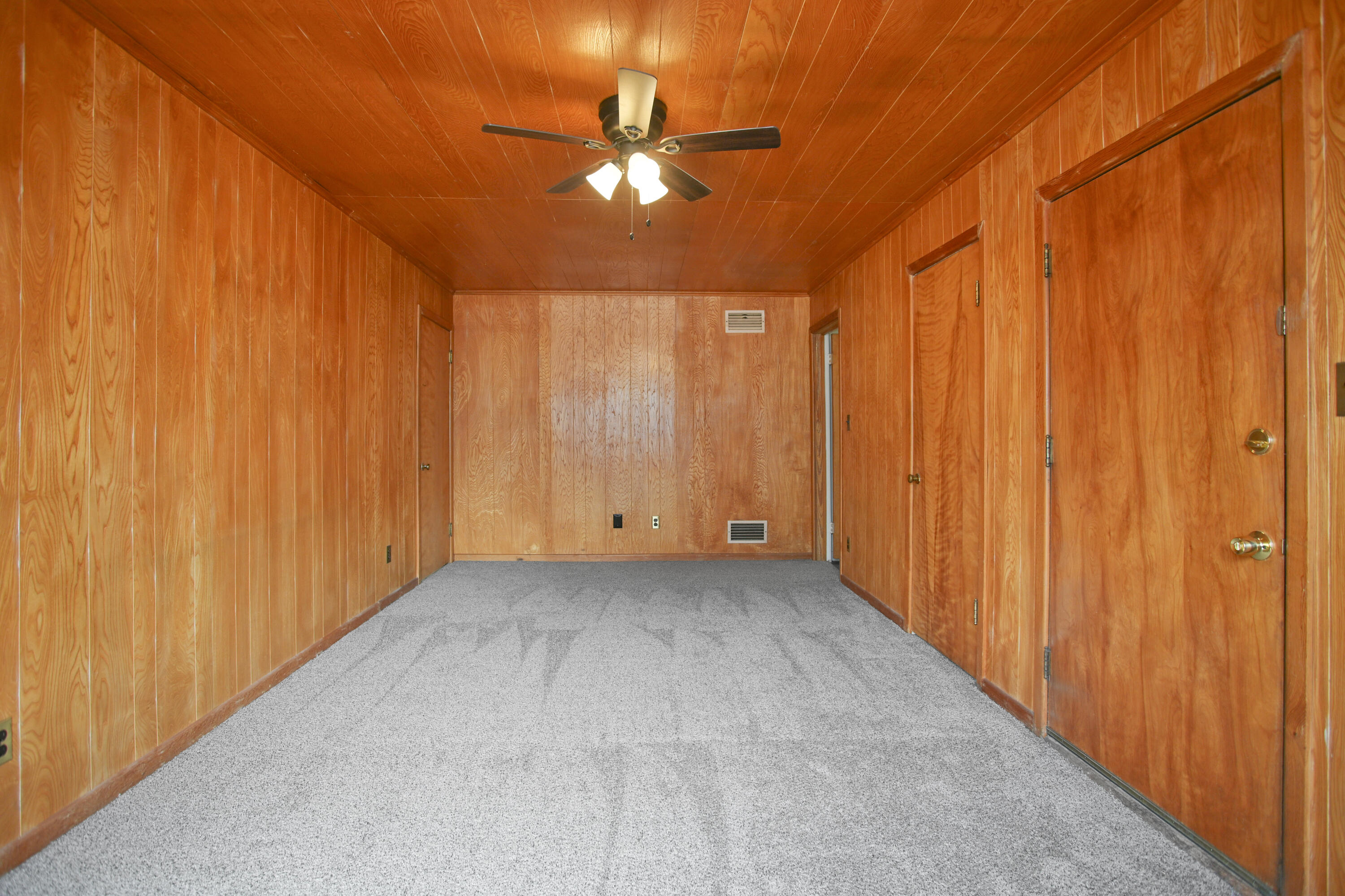 4309 31st Street Lubbock, TX 79410 - Photo 19 of 30 a view of a room with a chandelier fan