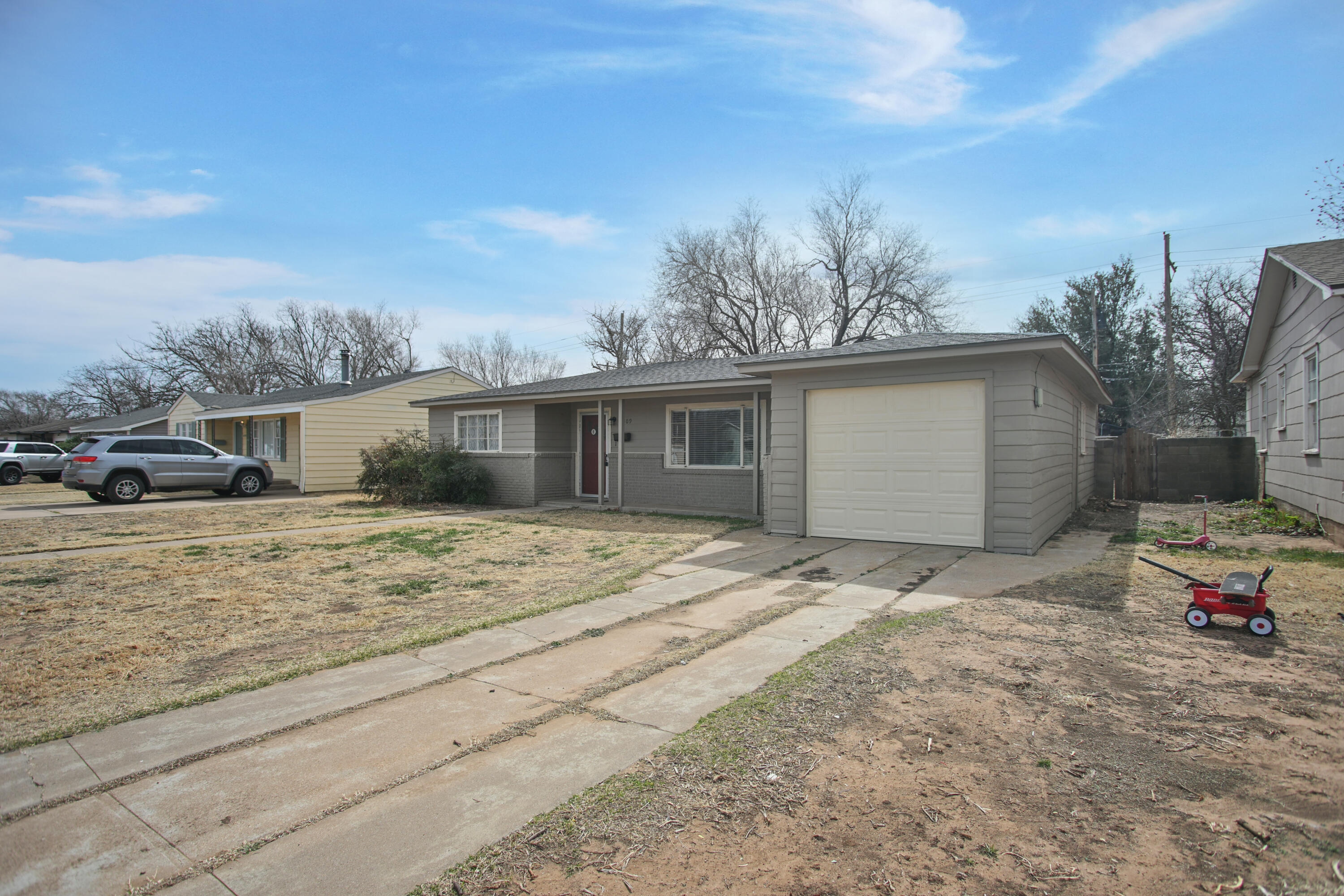 4309 31st Street Lubbock, TX 79410 - Photo 2 of 30 a front view of a house with a yard