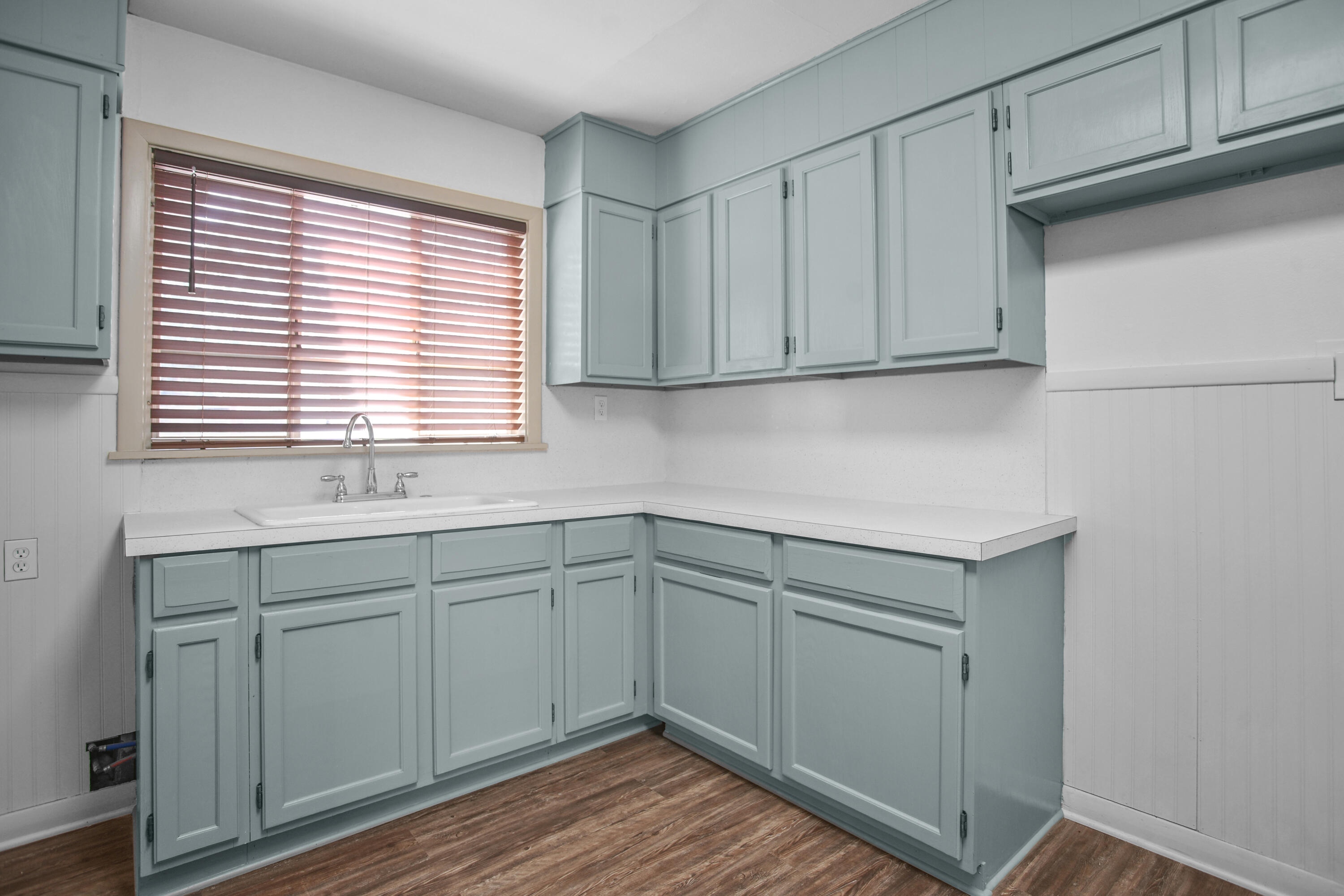 4309 31st Street Lubbock, TX 79410 - Photo 26 of 30 a kitchen with a sink cabinets and window