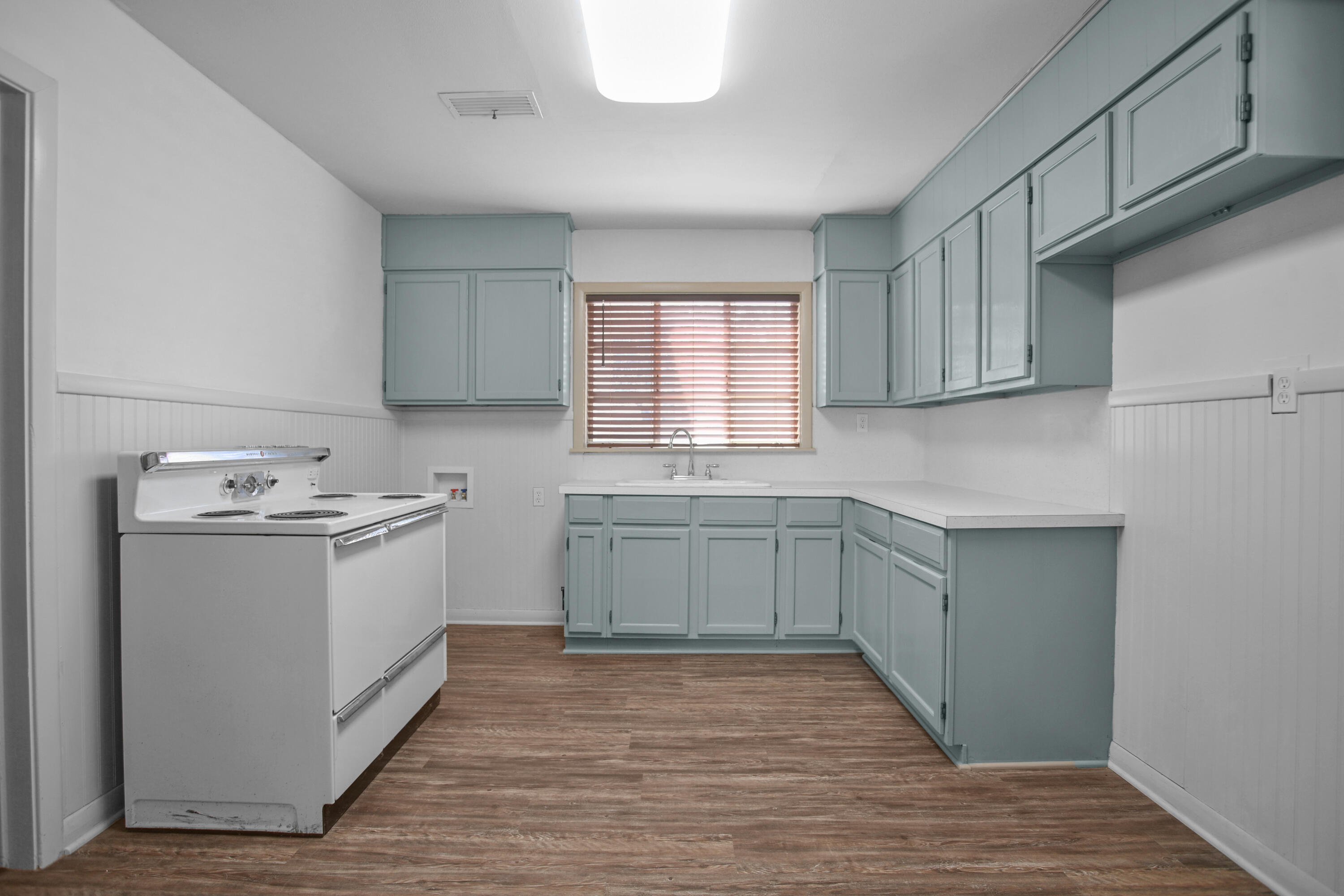 4309 31st Street Lubbock, TX 79410 - Photo 27 of 30 a kitchen with a sink cabinets stainless steel appliances and a window