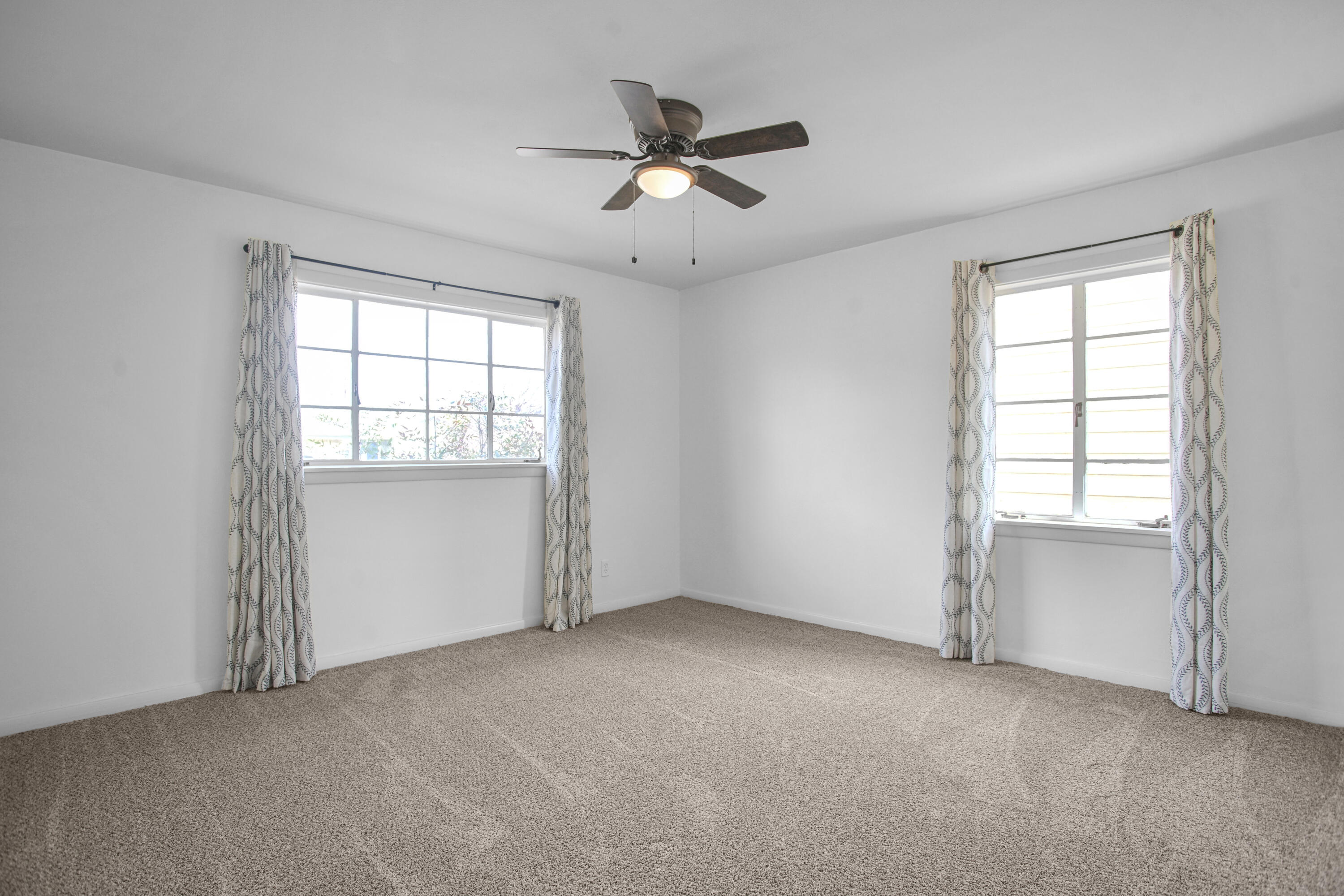4309 31st Street Lubbock, TX 79410 - Photo 5 of 30 an empty room with windows and closet