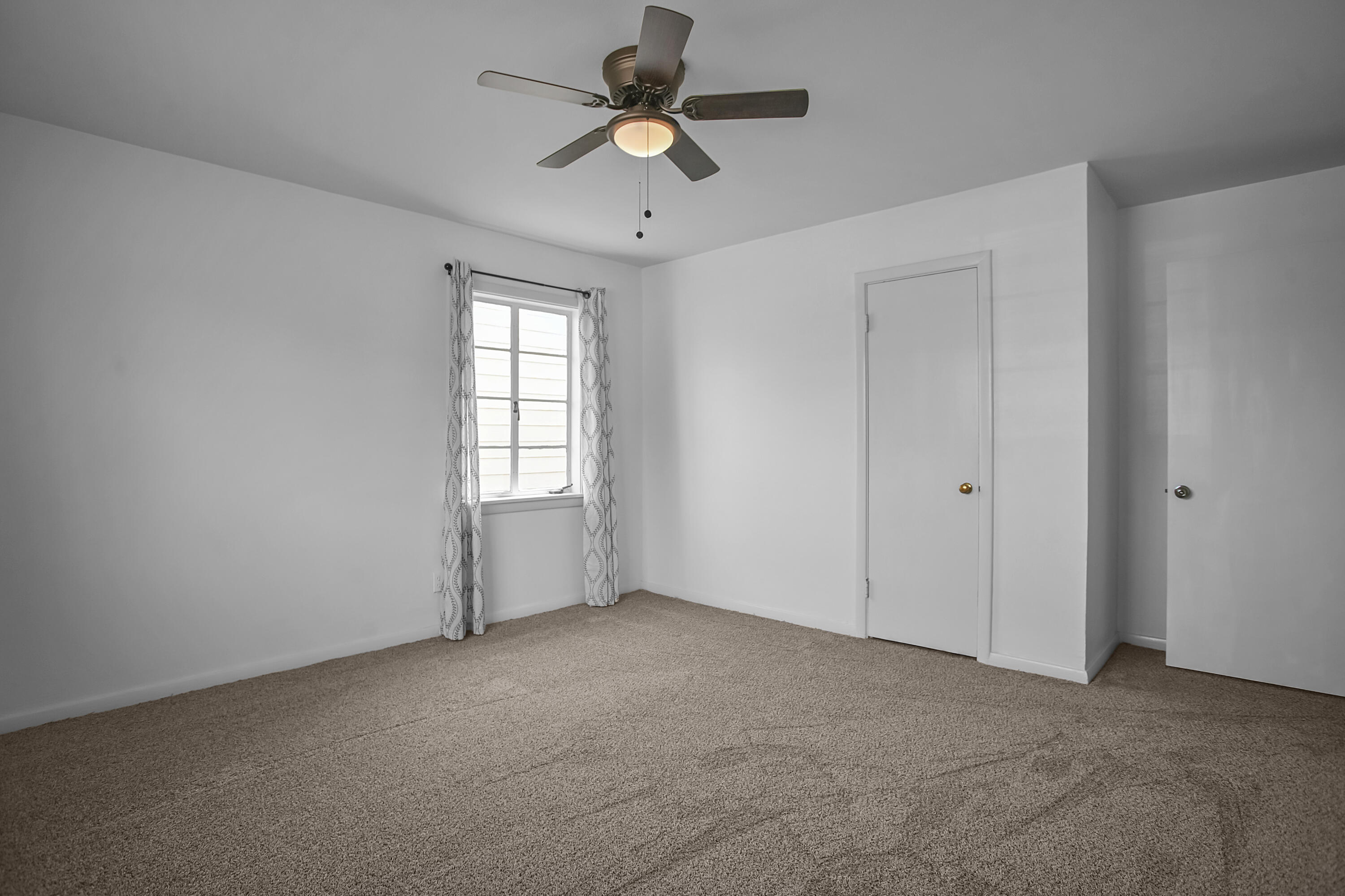 4309 31st Street Lubbock, TX 79410 - Photo 6 of 30 a view of an empty room with a window