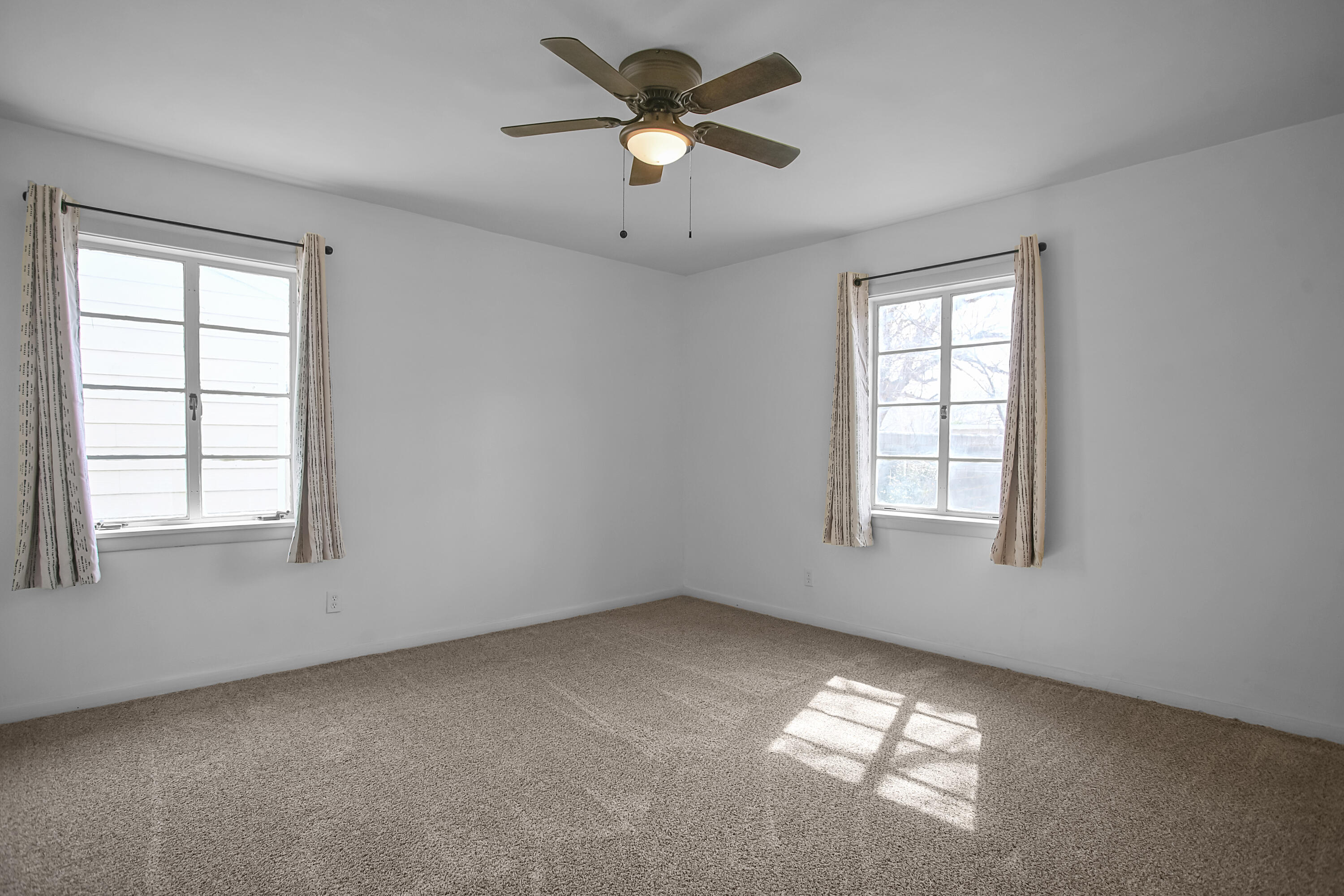 4309 31st Street Lubbock, TX 79410 - Photo 9 of 30 a view of an empty room with a window