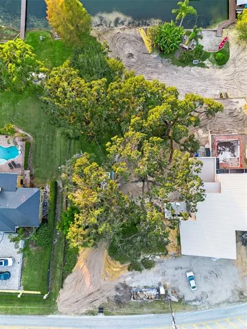 a front view of a house with a yard and garden