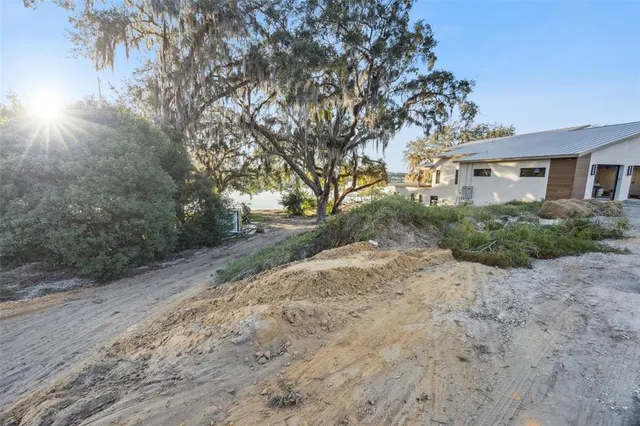 a pathway of a house with a yard