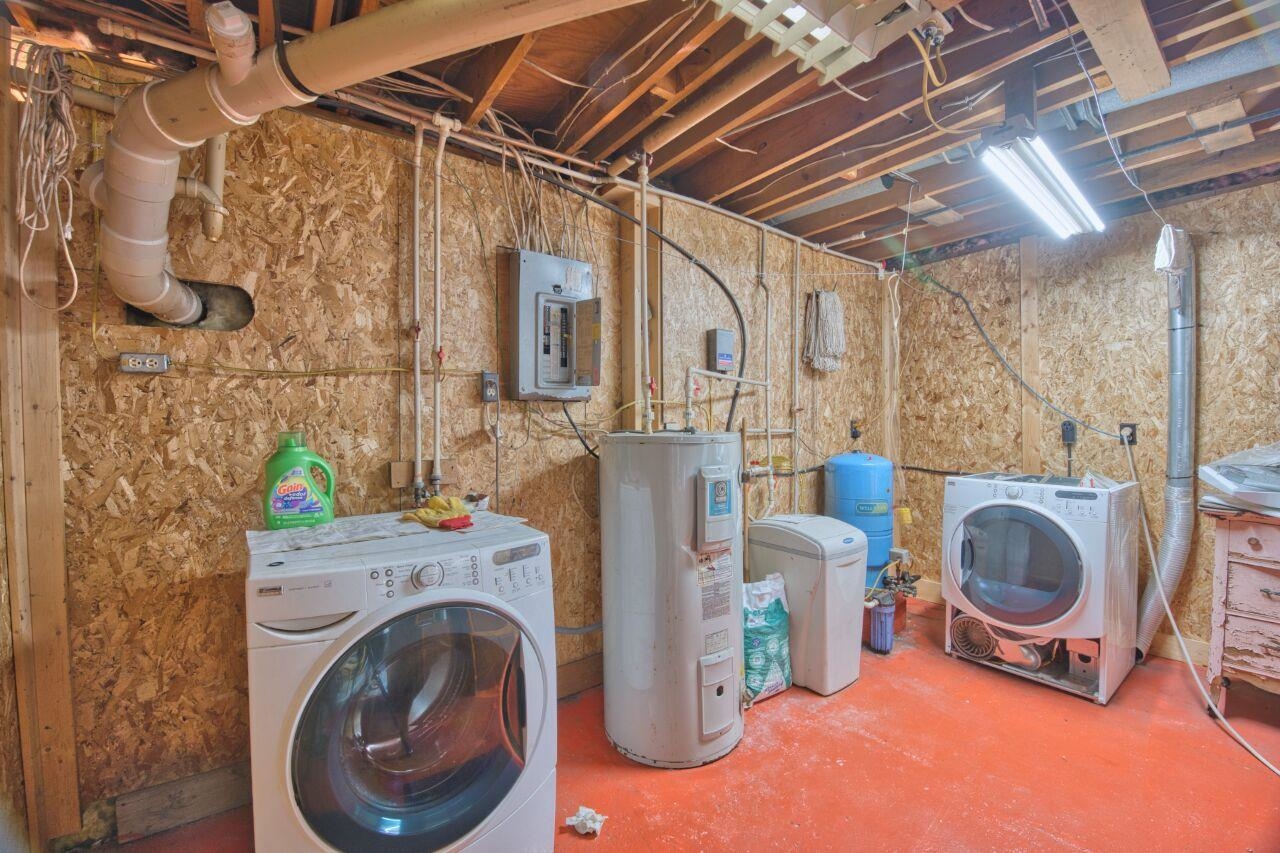 7349 Lax Road Embarrass, MN 55732 - Photo 14 of 36 Laundry area with concrete flooring, electric water heater, and electric panel