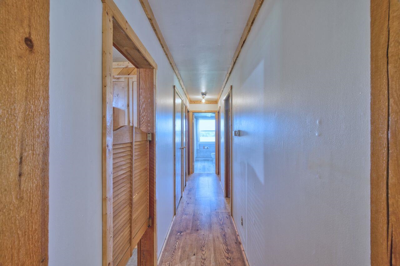 7349 Lax Road Embarrass, MN 55732 - Photo 9 of 36 Hall featuring hardwood / wood-style floors and baseboards