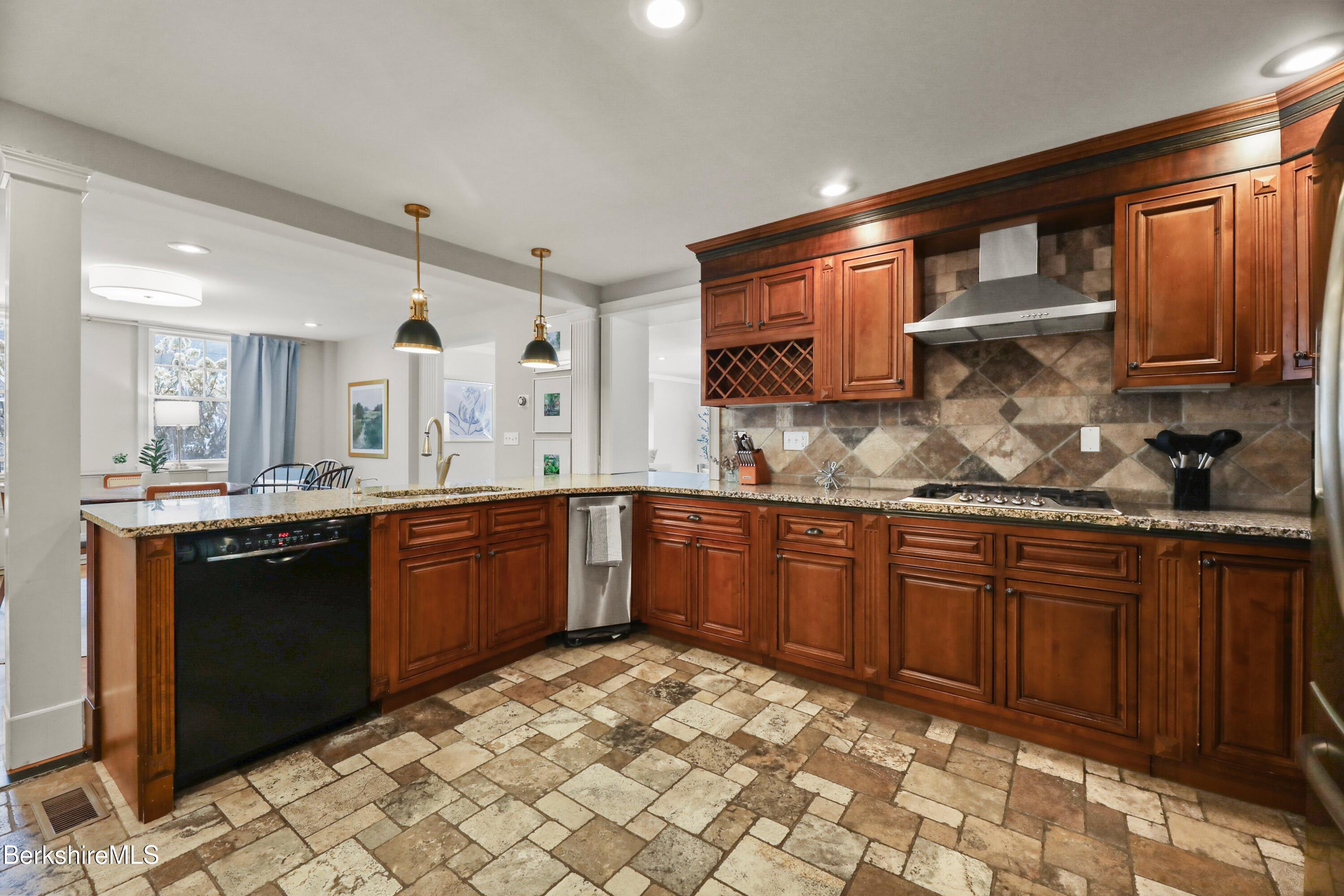 1 Devon Road Stockbridge, MA 01262 - Photo 9 of 58 a kitchen with granite countertop wooden cabinets and a sink