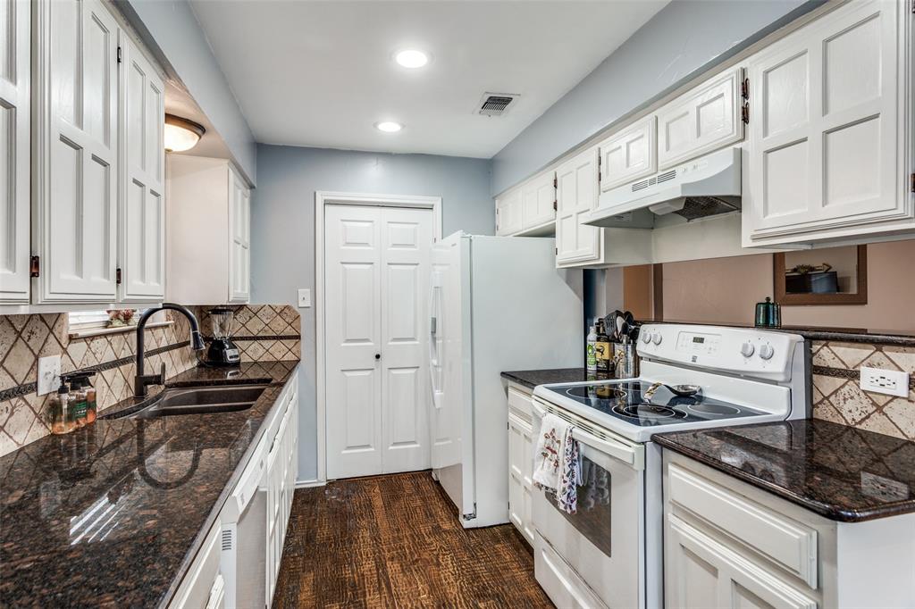 6304 Old Mill Circle Watauga, TX 76148 - Photo 12 of 25 a kitchen with stainless steel appliances granite countertop a stove and a refrigerator