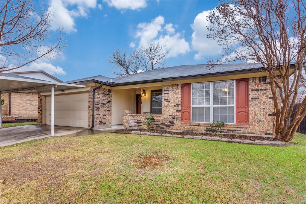 6304 Old Mill Circle Watauga, TX 76148 - Photo 2 of 25 front view of a house with a yard