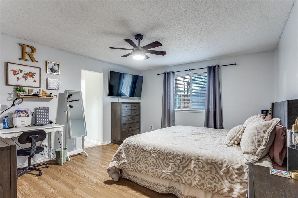 6304 Old Mill Circle Watauga, TX 76148 - Photo 21 of 25 a bedroom with a bed dresser and a window