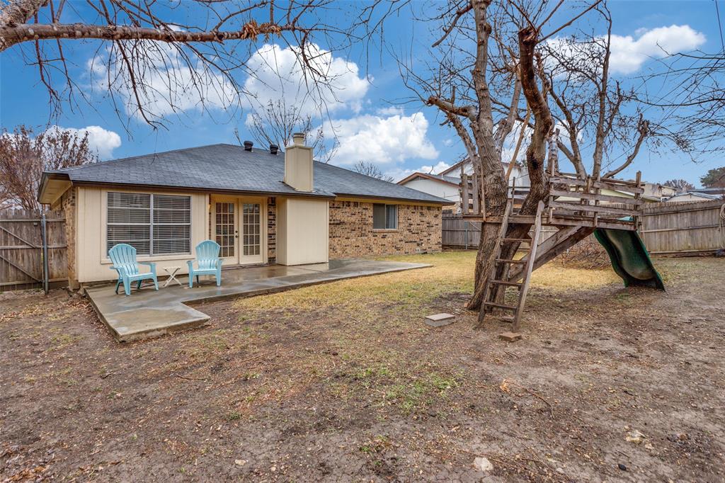 6304 Old Mill Circle Watauga, TX 76148 - Photo 24 of 25 a view of a house with backyard and sitting area