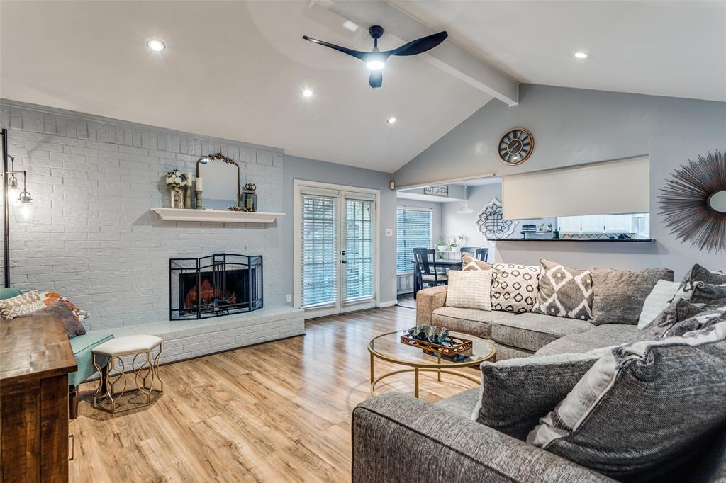 6304 Old Mill Circle Watauga, TX 76148 - Photo 8 of 25 a living room with furniture and a fireplace