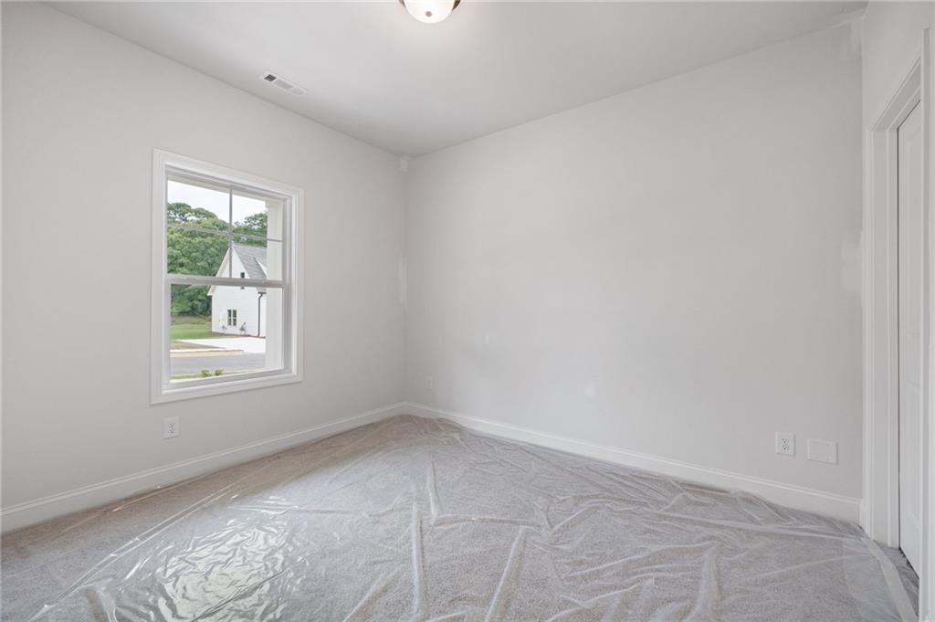 103 Winston Way Carrollton, GA 30117 - Photo 13 of 24 an empty room with a window