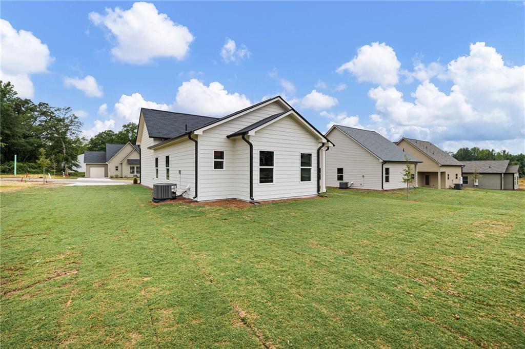 103 Winston Way Carrollton, GA 30117 - Photo 18 of 24 a view of a house with a yard