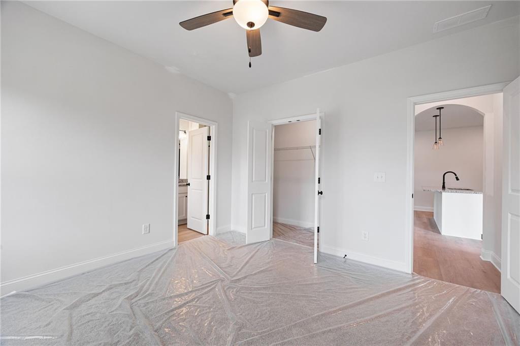 103 Winston Way Carrollton, GA 30117 - Photo 6 of 24 a view of a livingroom with a chandelier fan