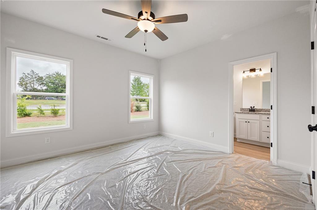 103 Winston Way Carrollton, GA 30117 - Photo 7 of 24 a bedroom with a bed and a window