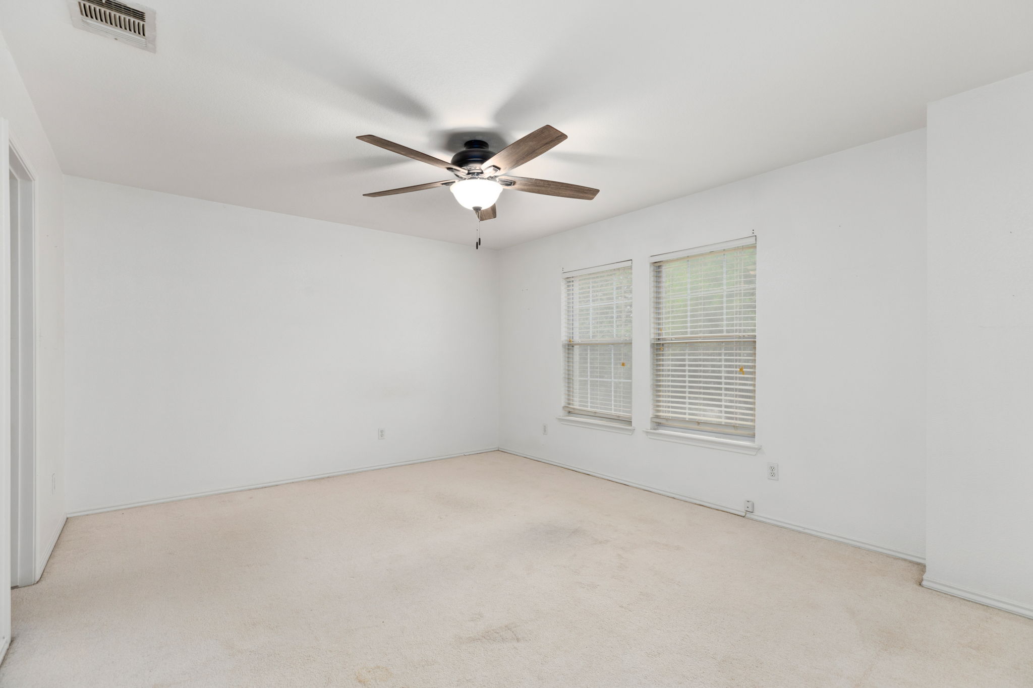 144 Vicksburg Loop Elgin, TX 78621 - Photo 19 of 23 an empty room with chandelier fan