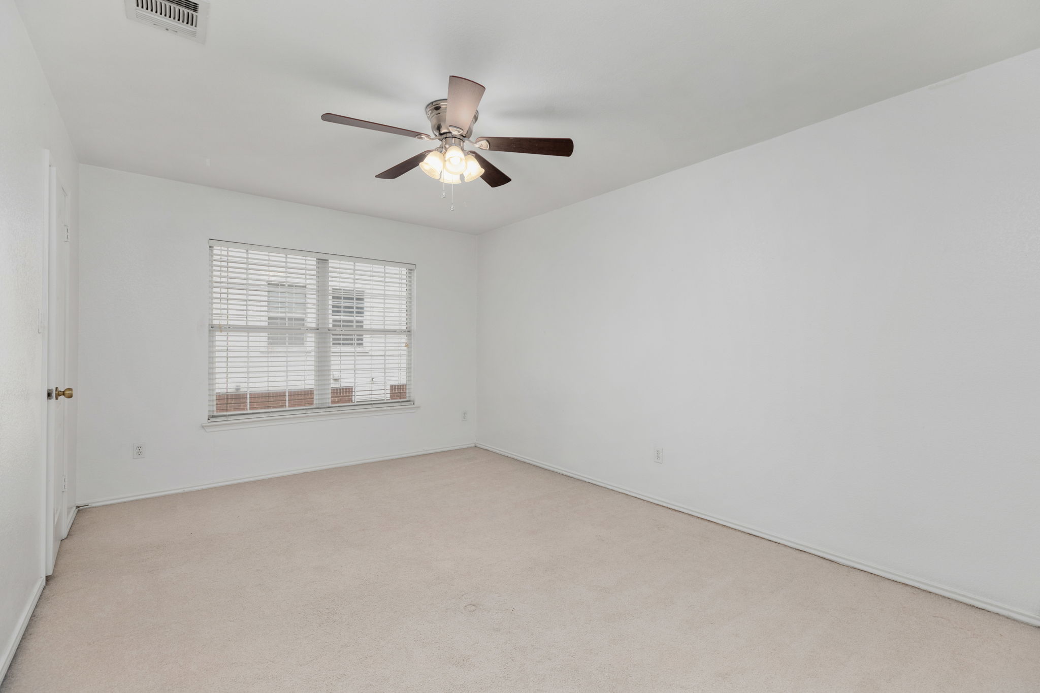 144 Vicksburg Loop Elgin, TX 78621 - Photo 20 of 23 a view of an empty room with a window