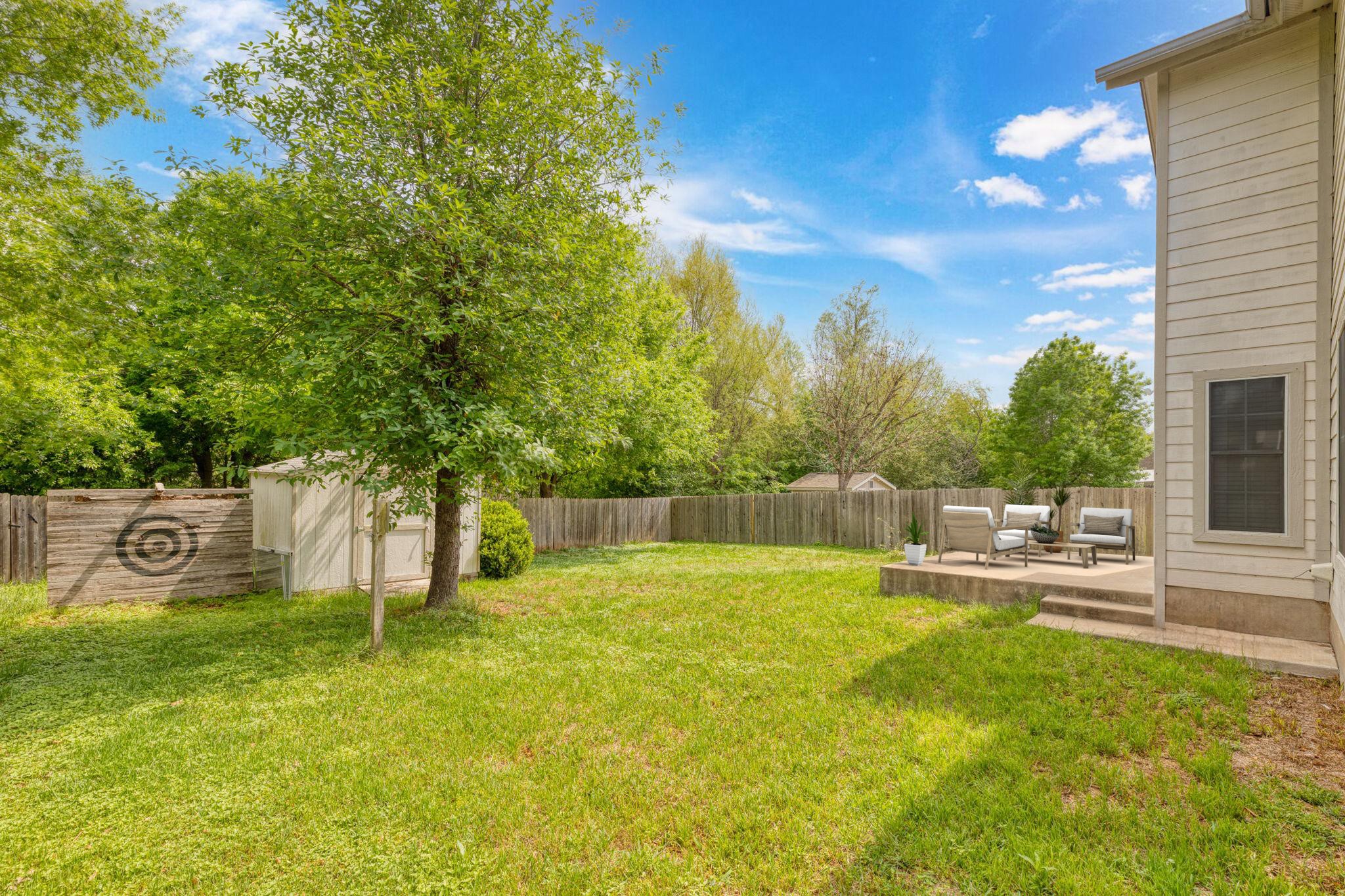 144 Vicksburg Loop Elgin, TX 78621 - Photo 2 of 23 a view of a backyard with a house