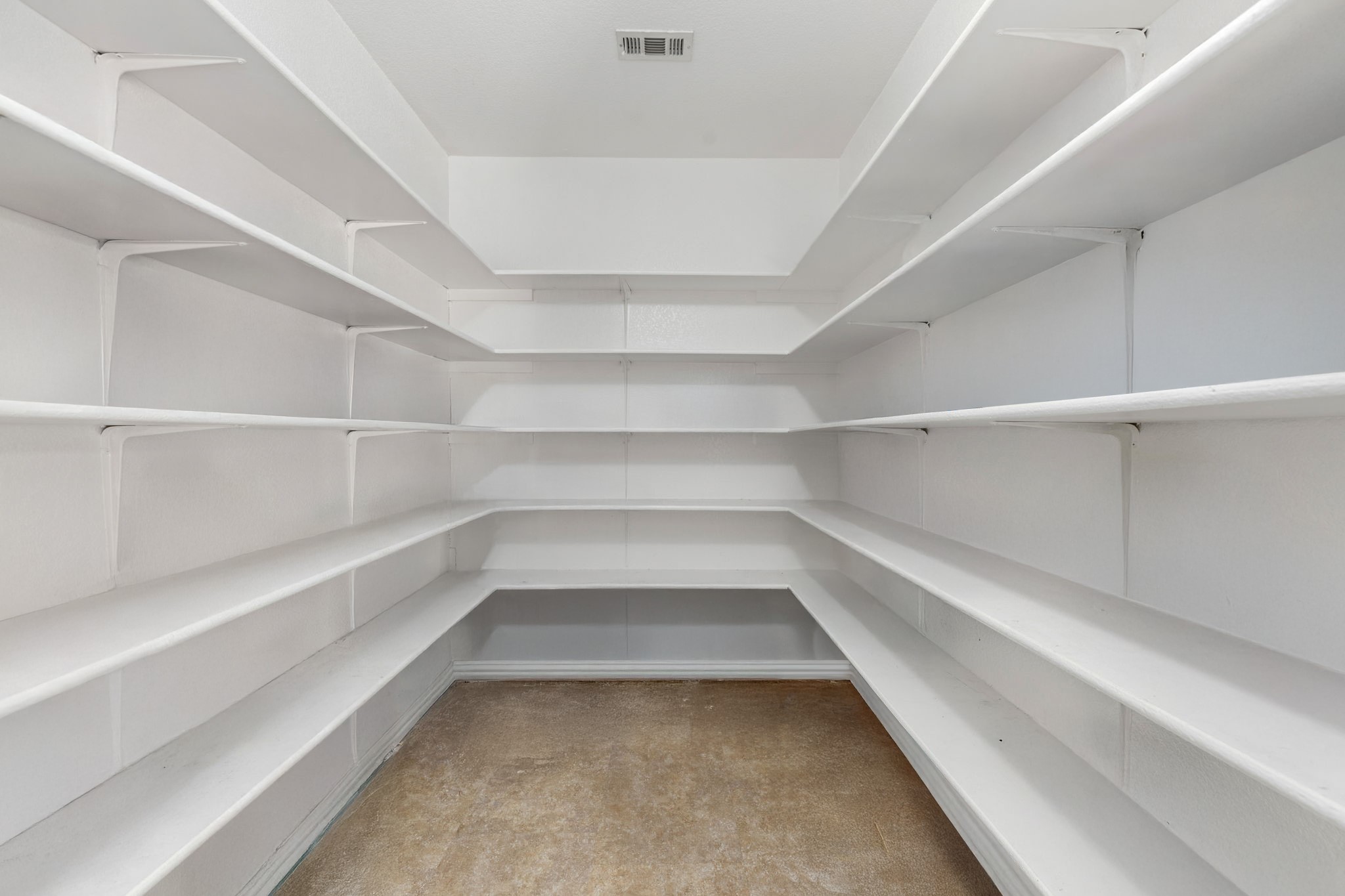 144 Vicksburg Loop Elgin, TX 78621 - Photo 8 of 23 a view of walk in closet with empty racks