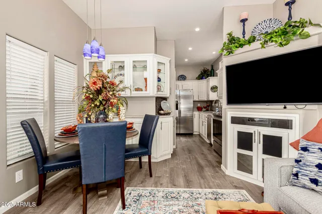 a kitchen with stainless steel appliances a stove a sink and a microwave
