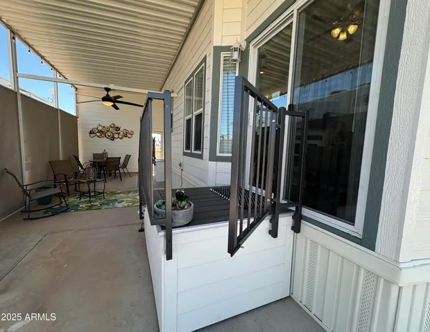 a front view of a building with palm tree
