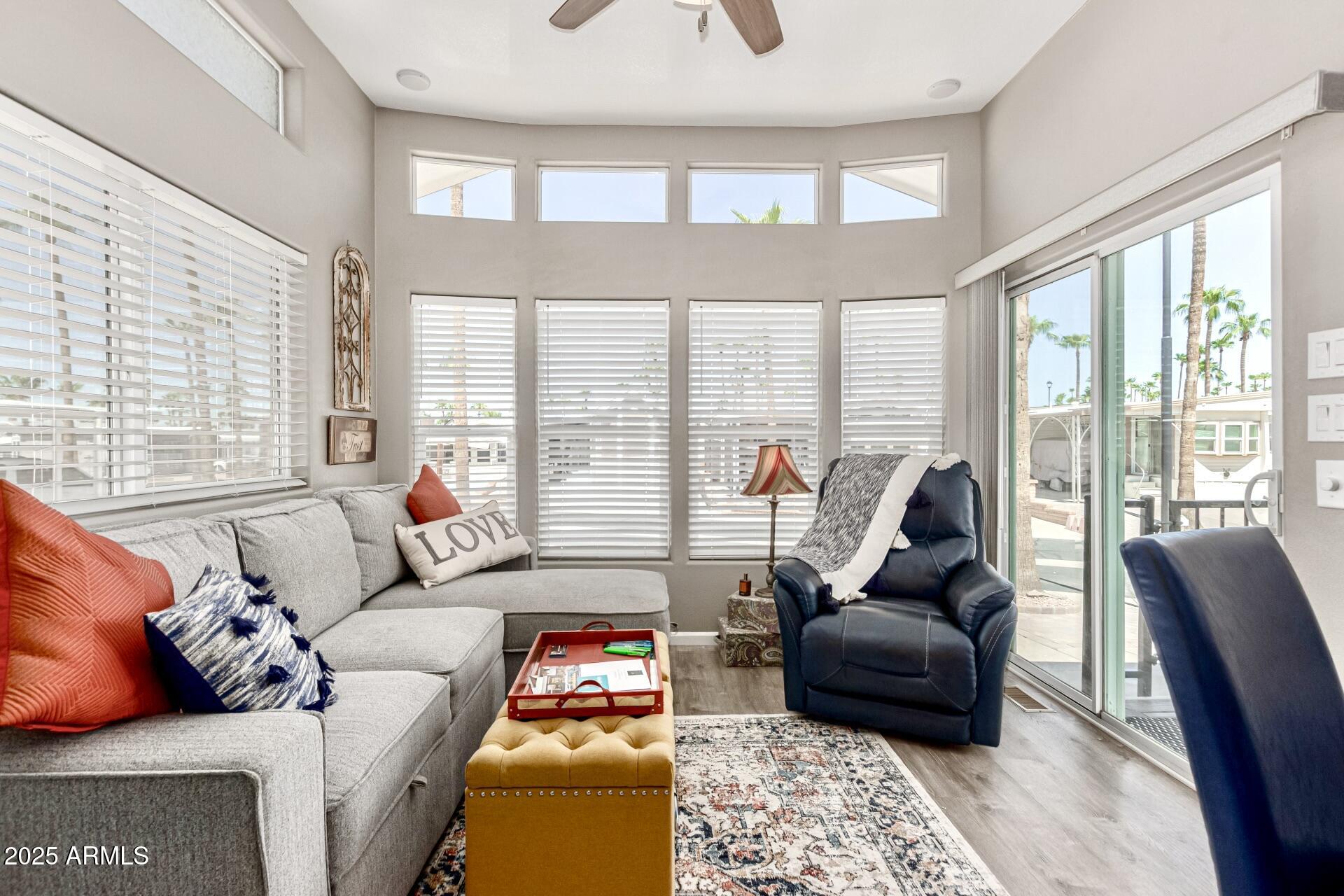 1374 West Chesapeake Avenue Apache Junction, AZ 85119 - Photo 10 of 33 a living room with furniture and a floor to ceiling window