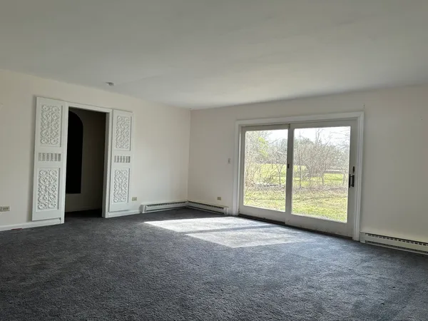 a view of an empty room with a window