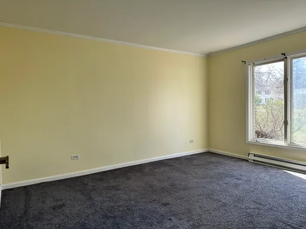 an empty room with a empty space and a window