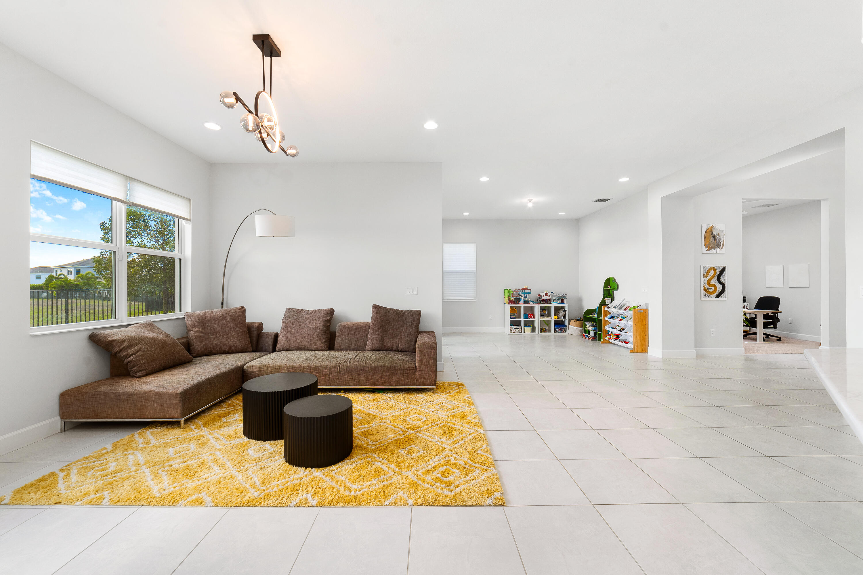 5487 Macoon Way Loxahatchee, FL 33470 - Photo 16 of 66 a living room with furniture and a table
