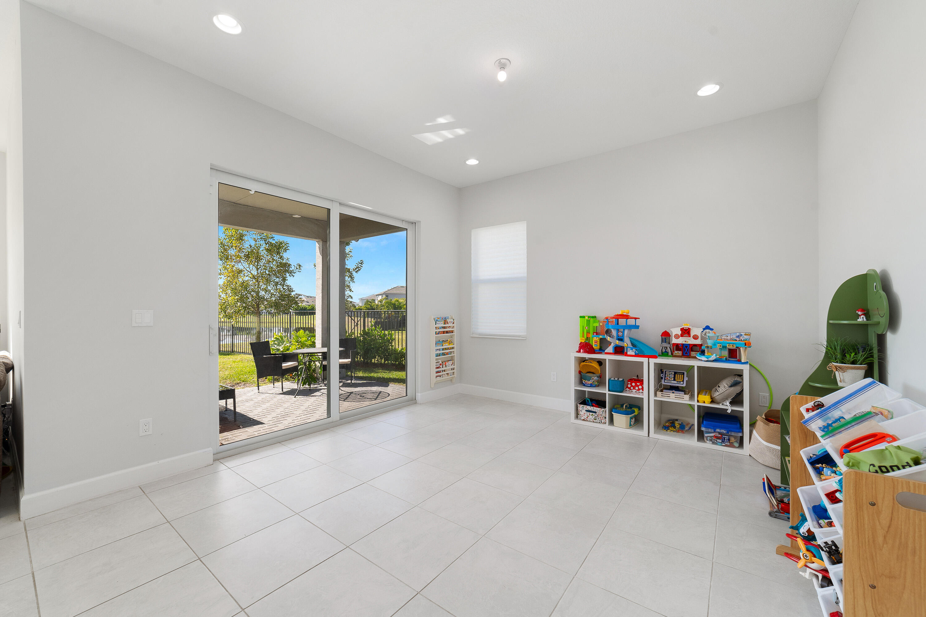 5487 Macoon Way Loxahatchee, FL 33470 - Photo 17 of 66 a view of a room with toys and a potted plant