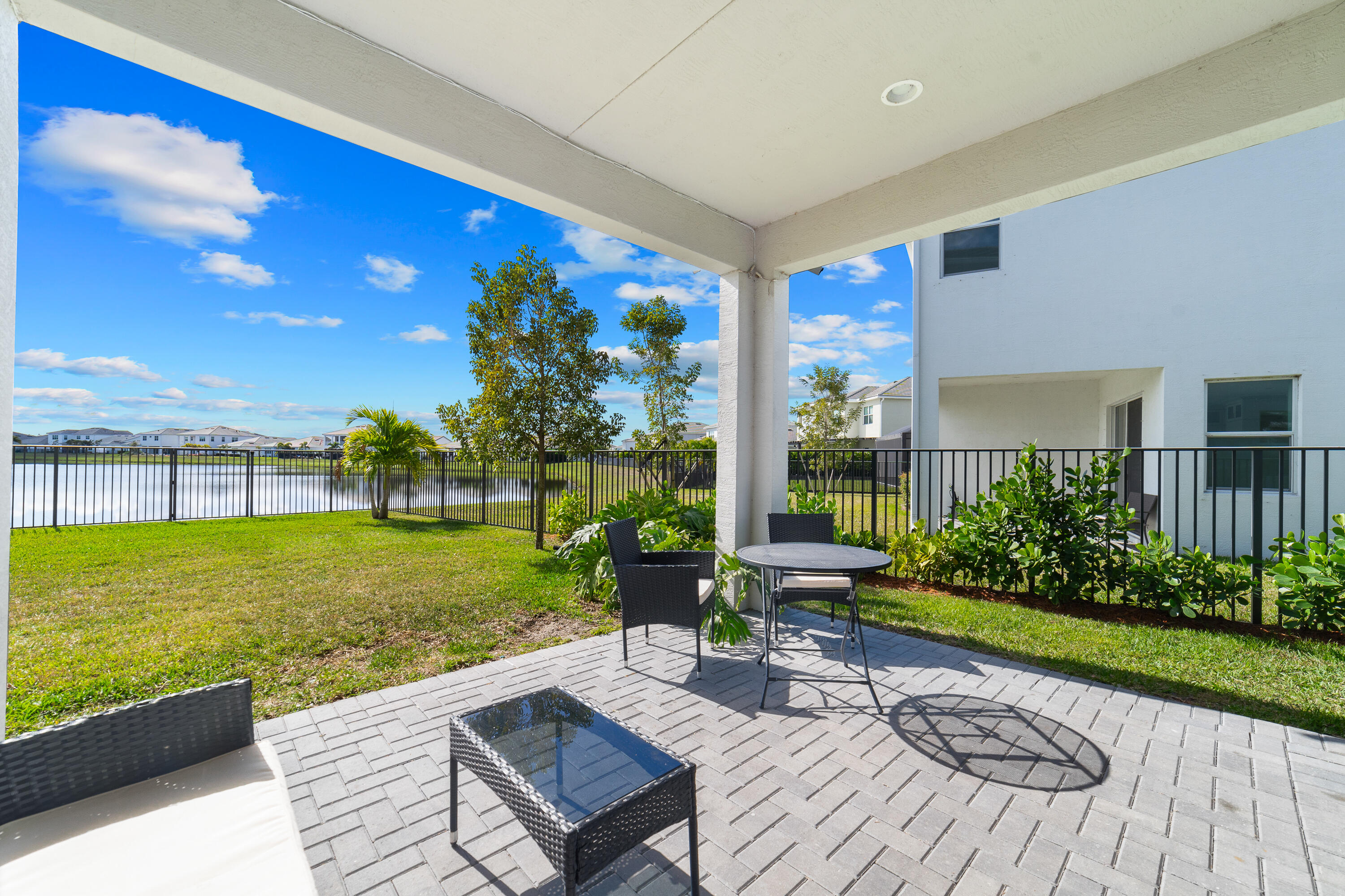 5487 Macoon Way Loxahatchee, FL 33470 - Photo 18 of 66 a view of a patio with garden